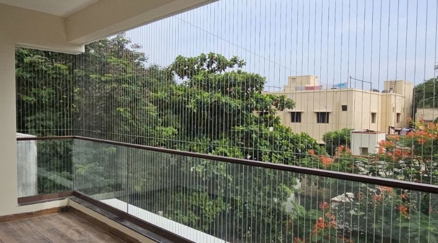 Balcony with invisible grill offering clear view and safety in a Chennai apartment